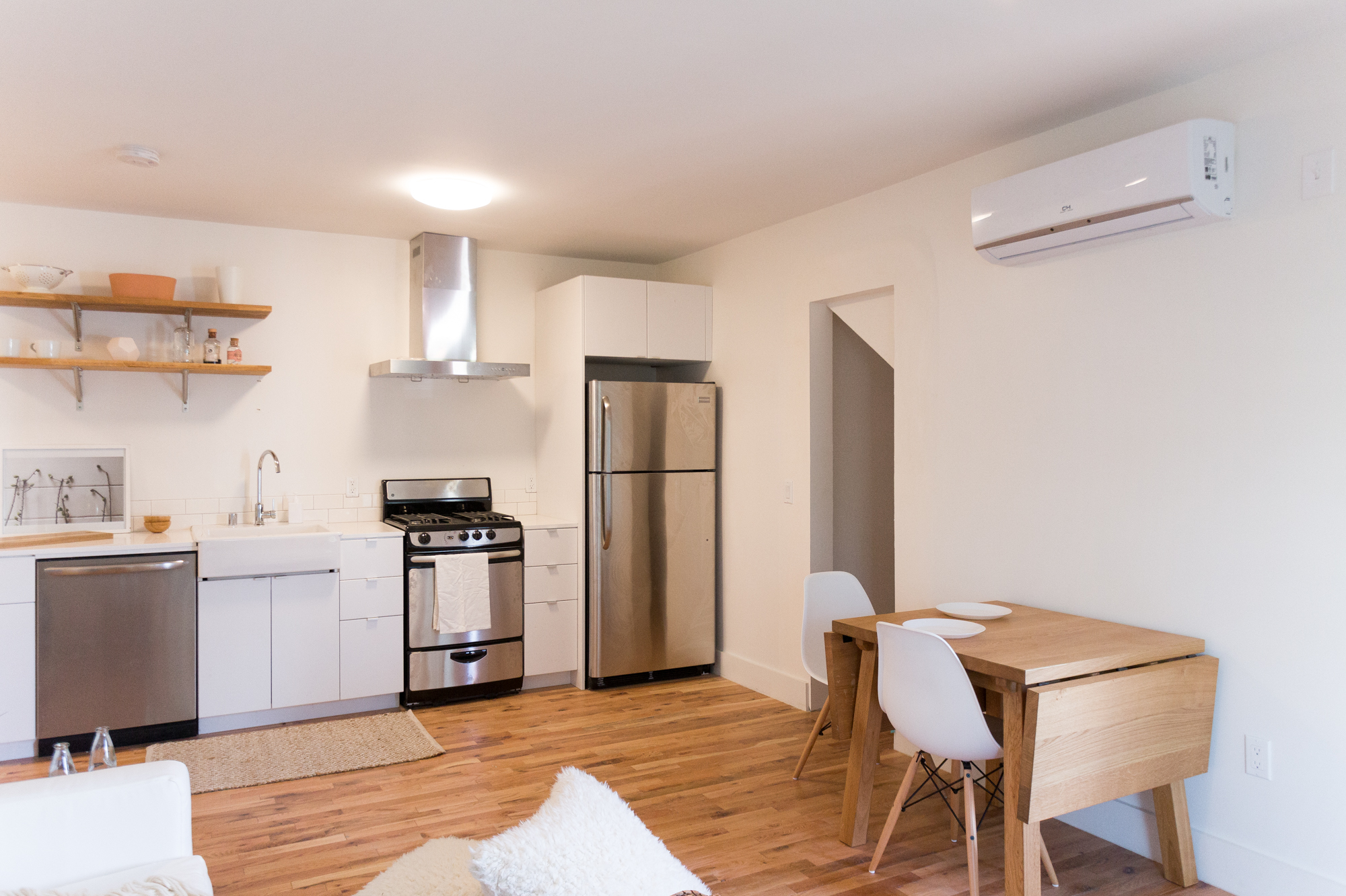 a%20modern%20white%20kitchen%20with%20light%20wood%20accents